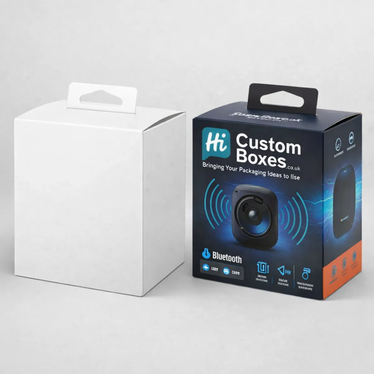 A white mock-up box and a printed blue Bluetooth speaker box with a hanging tab. class=